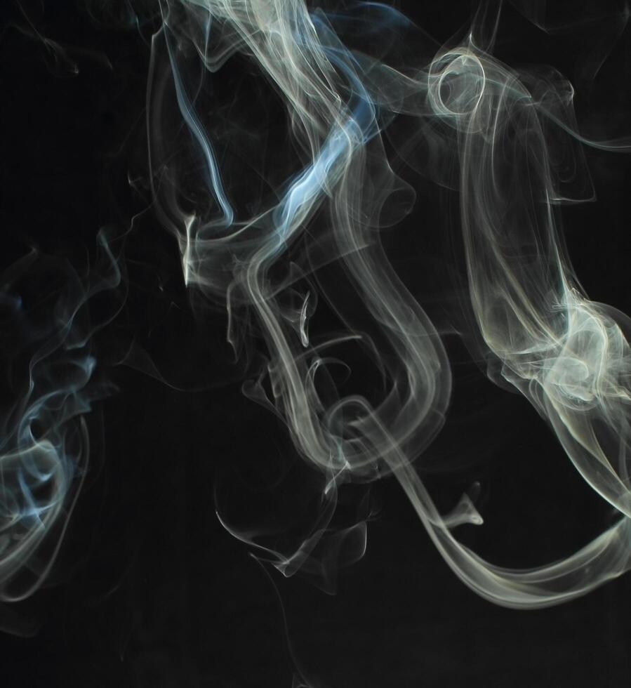 Abstract white smoke texture moves on black background Plume of smoke wave design wallpaper. Design element. Abstract texture photo