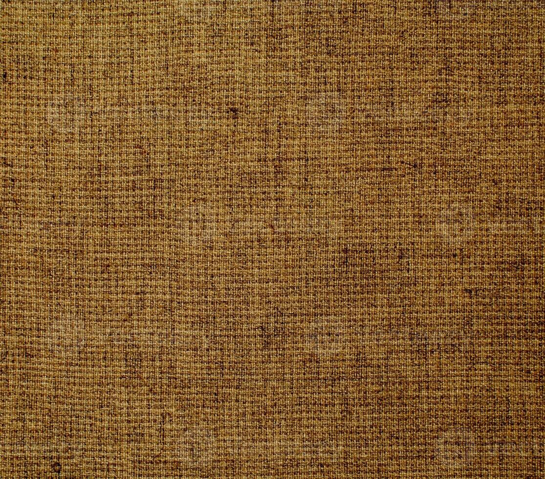 Natural linen material textile canvas Fabric texture background Close-up detail of fabric natural color Hemp material pattern design wallpaper. can be used as background or for graphic design photo