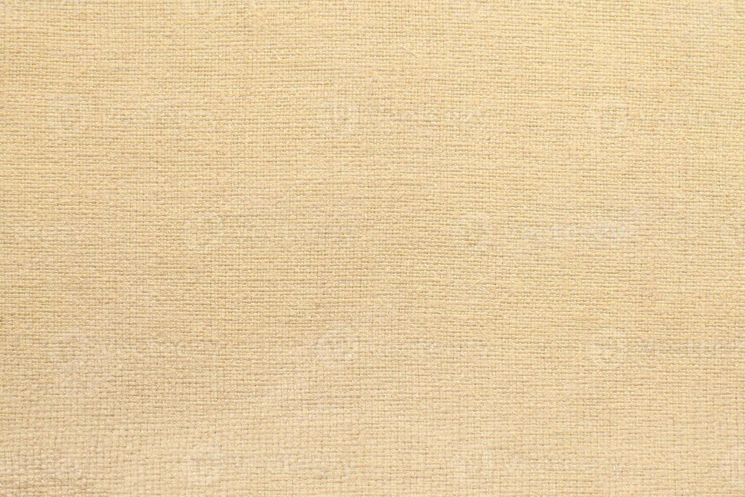 Natural linen material textile canvas Fabric texture background Close-up detail of fabric natural color Hemp material pattern design wallpaper. can be used as background or for graphic design photo