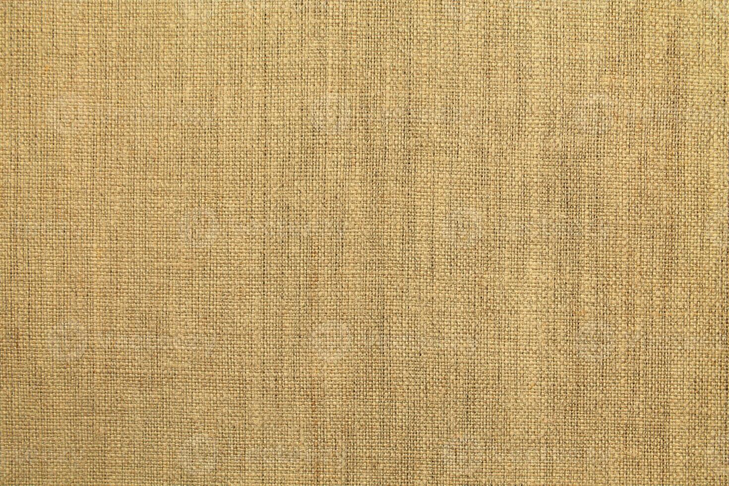 Natural linen material textile canvas Fabric texture background Close-up detail of fabric natural color Hemp material pattern design wallpaper. can be used as background or for graphic design photo