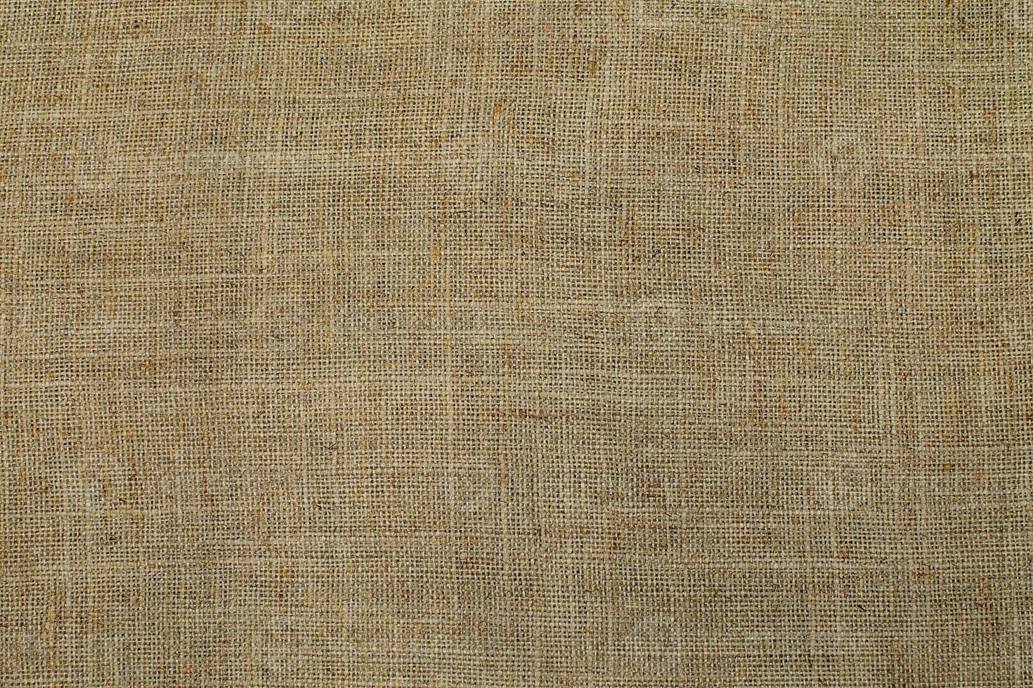Natural linen material textile canvas Fabric texture background Close-up detail of fabric natural color Hemp material pattern design wallpaper. can be used as background or for graphic design photo