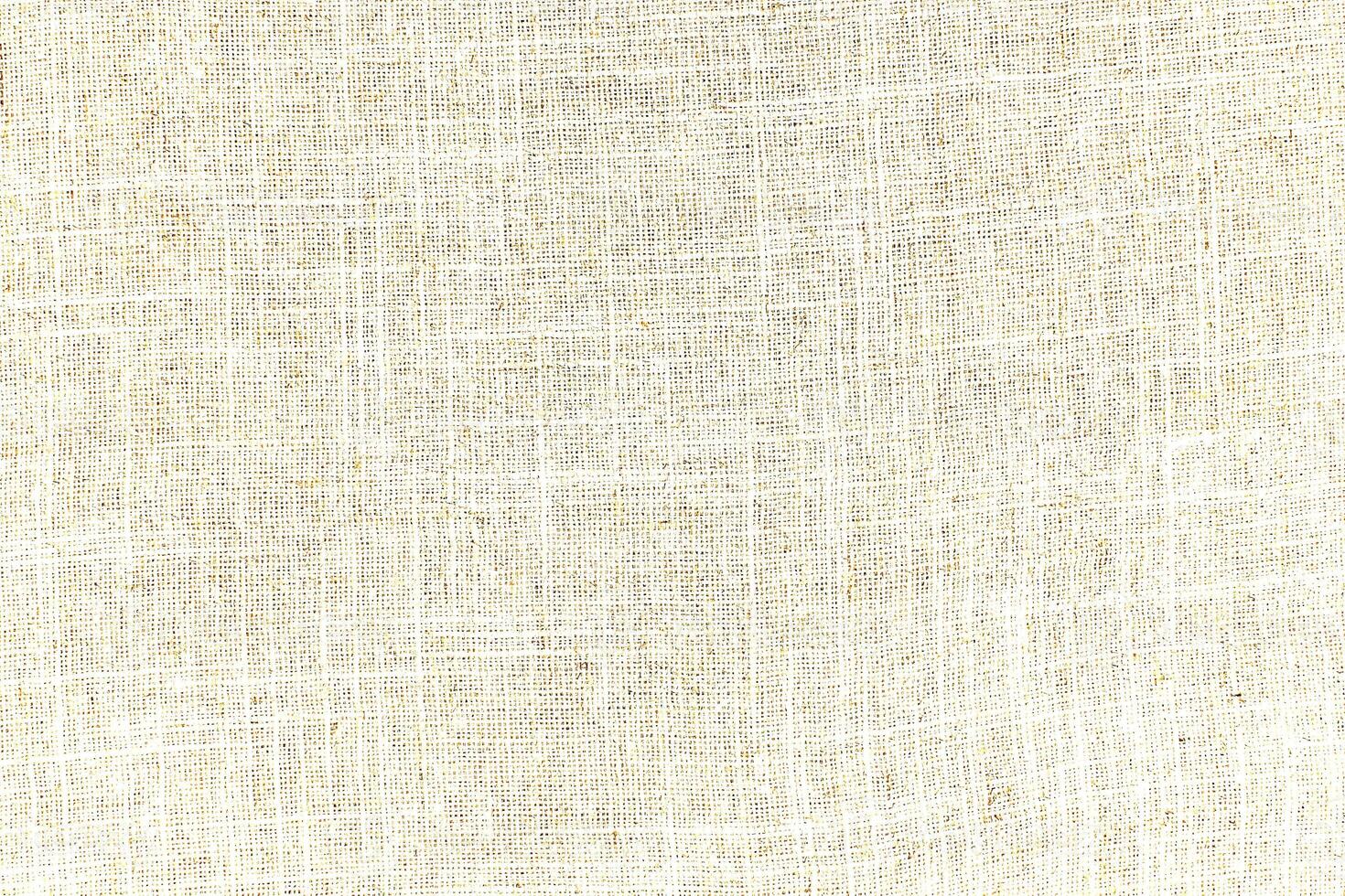 Natural linen material textile canvas Fabric texture background Close-up detail of fabric natural color Hemp material pattern design wallpaper. can be used as background or for graphic design photo