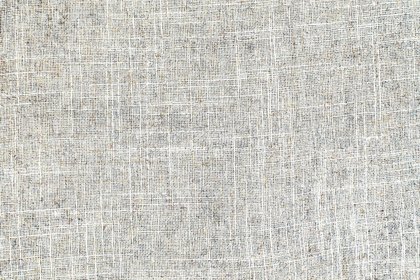 Natural linen material textile canvas Fabric texture background Close-up detail of fabric natural color Hemp material pattern design wallpaper. can be used as background or for graphic design photo