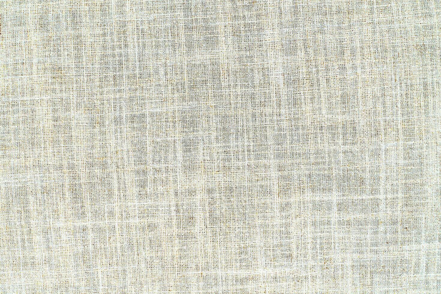 Natural linen material textile canvas Fabric texture background Close-up detail of fabric natural color Hemp material pattern design wallpaper. can be used as background or for graphic design photo