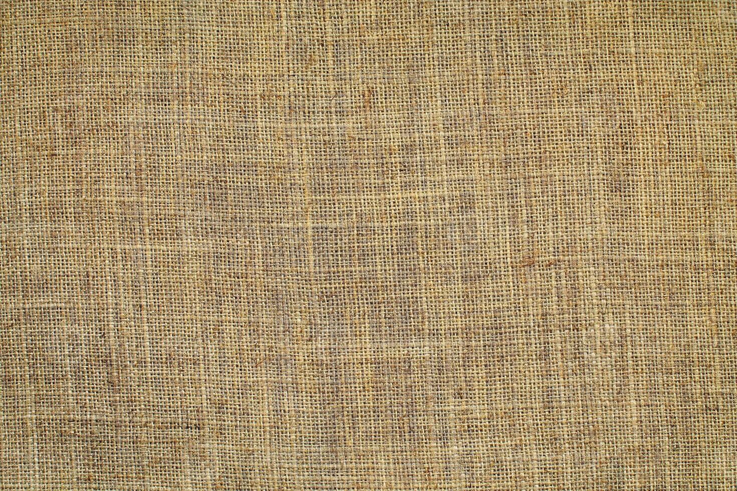 Natural linen material textile canvas Fabric texture background Close-up detail of fabric natural color Hemp material pattern design wallpaper. can be used as background or for graphic design photo