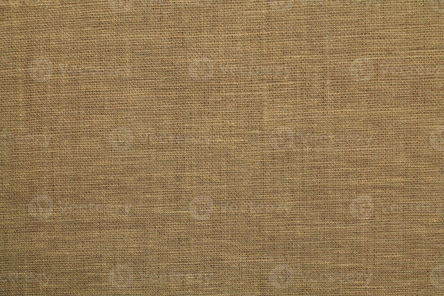 Natural linen material textile canvas Fabric texture background Close-up detail of fabric natural color Hemp material pattern design wallpaper. can be used as background or for graphic design photo