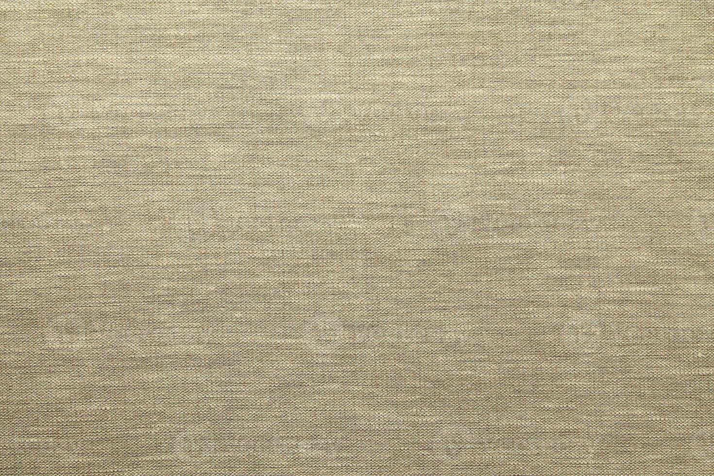 Natural linen material textile canvas Fabric texture background Close-up detail of fabric natural color Hemp material pattern design wallpaper. can be used as background or for graphic design photo