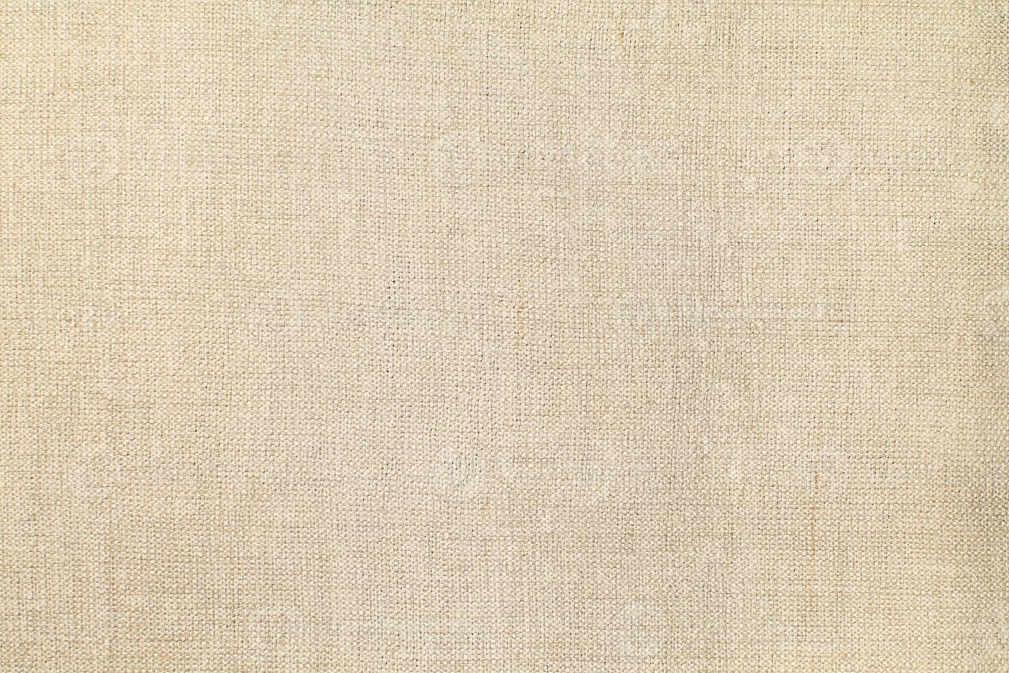 Natural linen material textile canvas Fabric texture background Close-up detail of fabric natural color Hemp material pattern design wallpaper. can be used as background or for graphic design photo