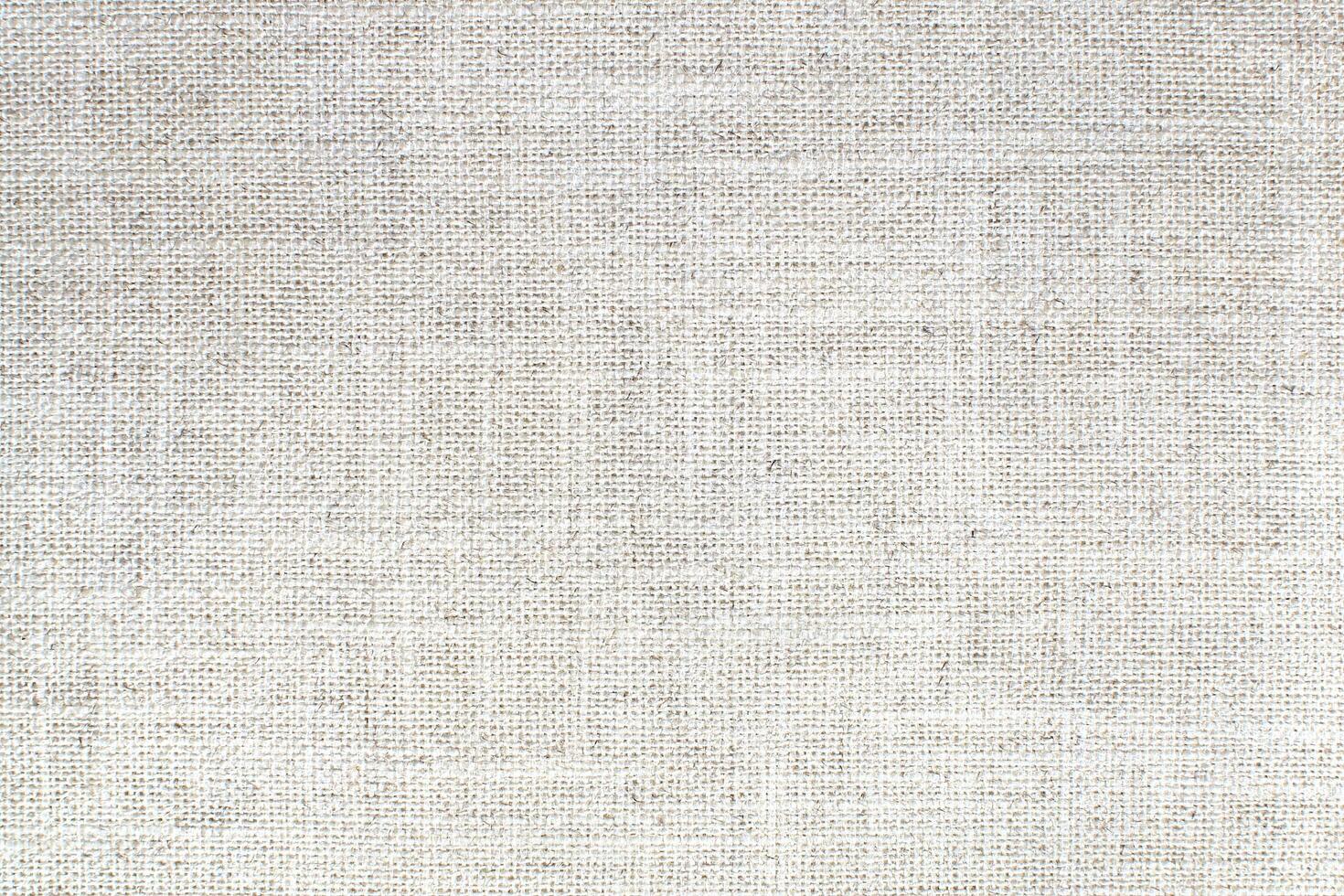 Natural linen material textile canvas Fabric texture background Close-up detail of fabric natural color Hemp material pattern design wallpaper. can be used as background or for graphic design photo