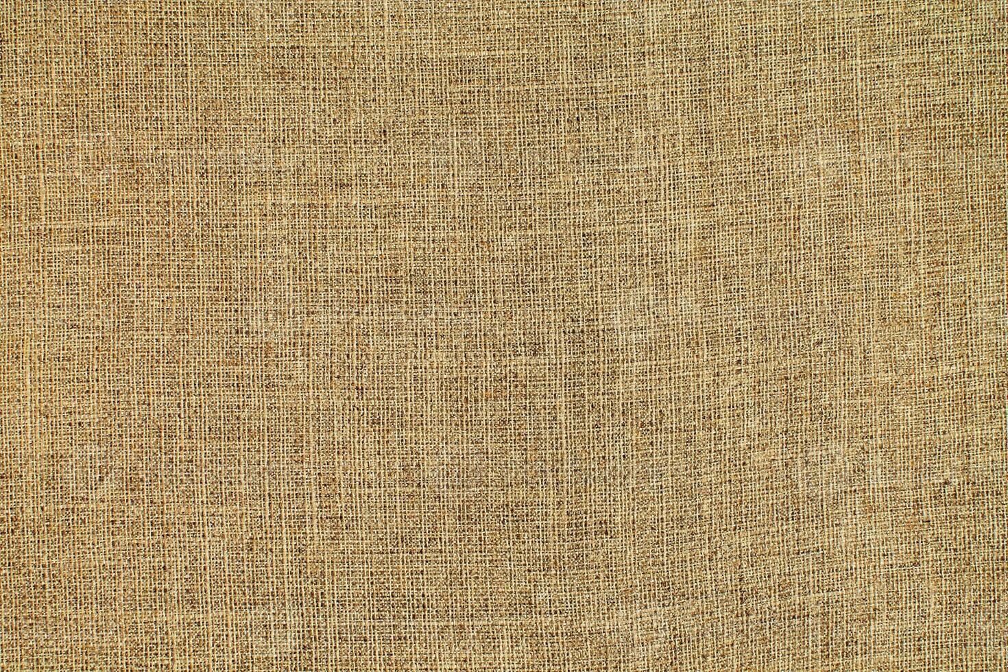 Natural linen material textile canvas Fabric texture background Close-up detail of fabric natural color Hemp material pattern design wallpaper. can be used as background or for graphic design photo