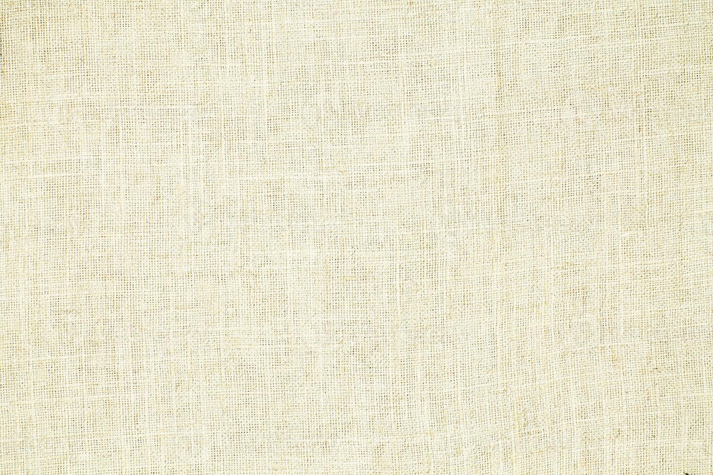 Natural linen material textile canvas Fabric texture background Close-up detail of fabric natural color Hemp material pattern design wallpaper. can be used as background or for graphic design photo