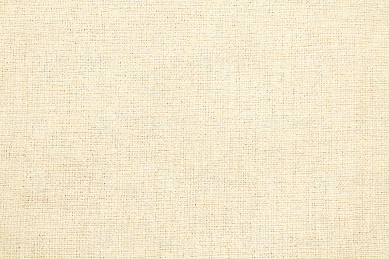 Natural linen material textile canvas Fabric texture background Close-up detail of fabric natural color Hemp material pattern design wallpaper. can be used as background or for graphic design photo