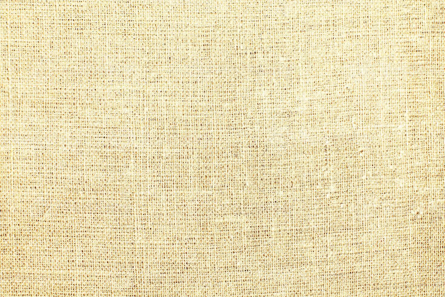 Natural linen material textile canvas Fabric texture background Close-up detail of fabric natural color Hemp material pattern design wallpaper. can be used as background or for graphic design photo
