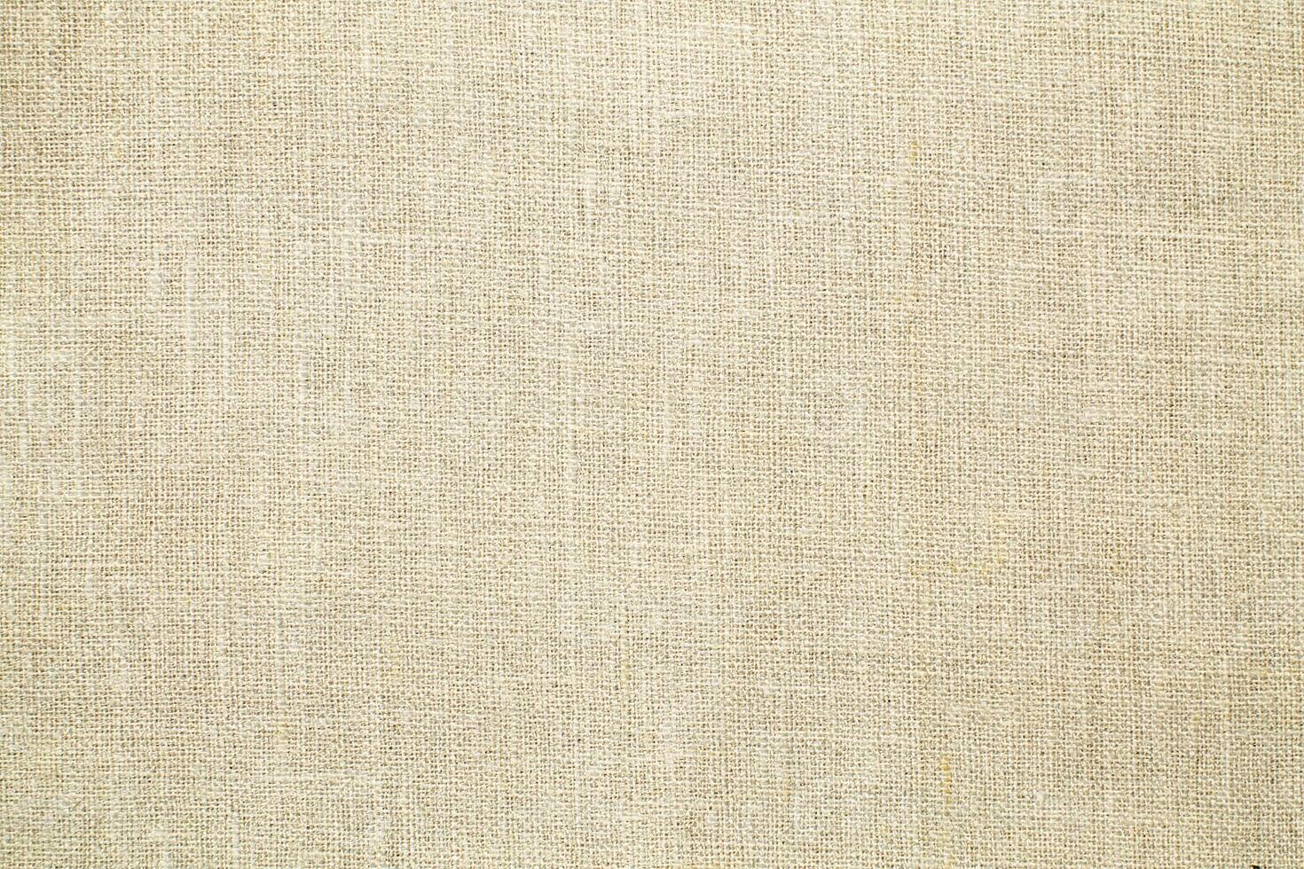 Natural linen material textile canvas Fabric texture background Close-up detail of fabric natural color Hemp material pattern design wallpaper. can be used as background or for graphic design photo
