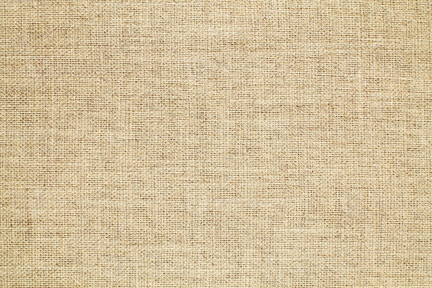 Natural linen material textile canvas Fabric texture background Close-up detail of fabric natural color Hemp material pattern design wallpaper. can be used as background or for graphic design photo
