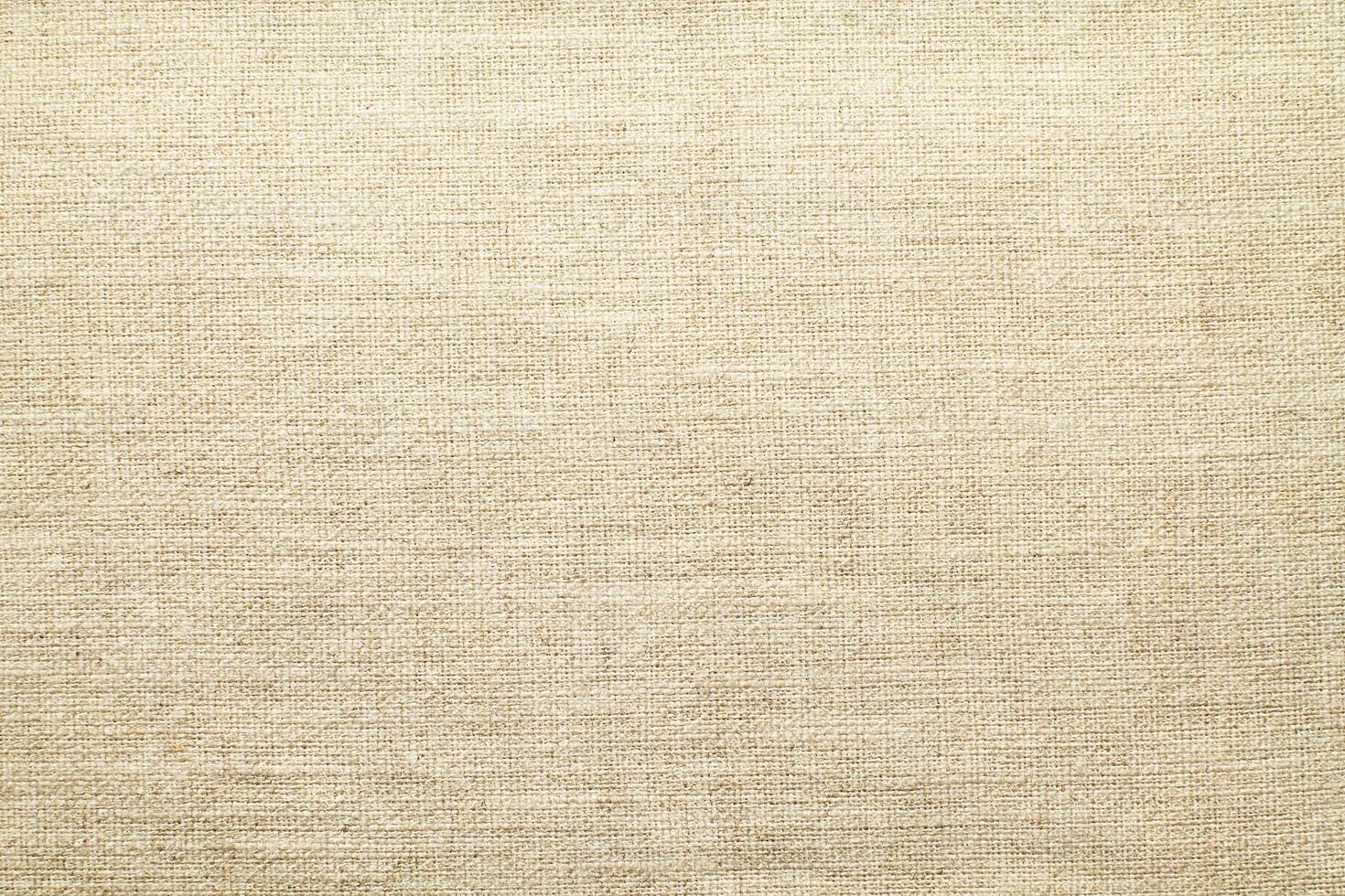 Natural linen material textile canvas Fabric texture background Close-up detail of fabric natural color Hemp material pattern design wallpaper. can be used as background or for graphic design photo