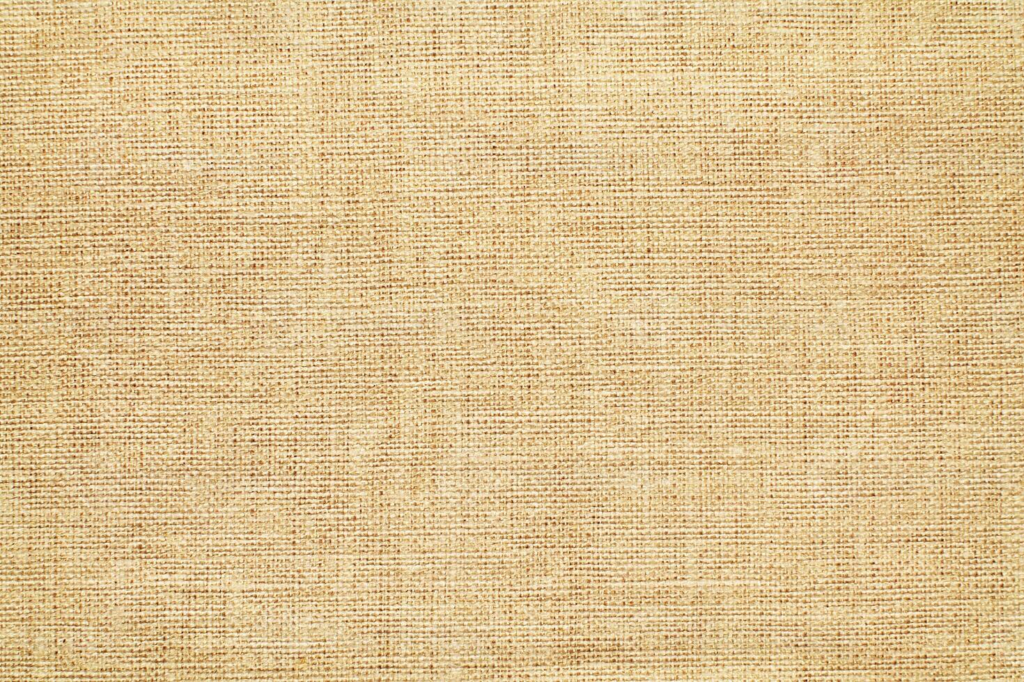 Natural linen material textile canvas Fabric texture background Close-up detail of fabric natural color Hemp material pattern design wallpaper. can be used as background or for graphic design photo