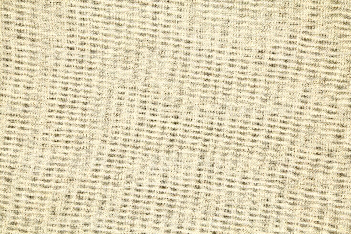 Natural linen material textile canvas Fabric texture background Close-up detail of fabric natural color Hemp material pattern design wallpaper. can be used as background or for graphic design photo