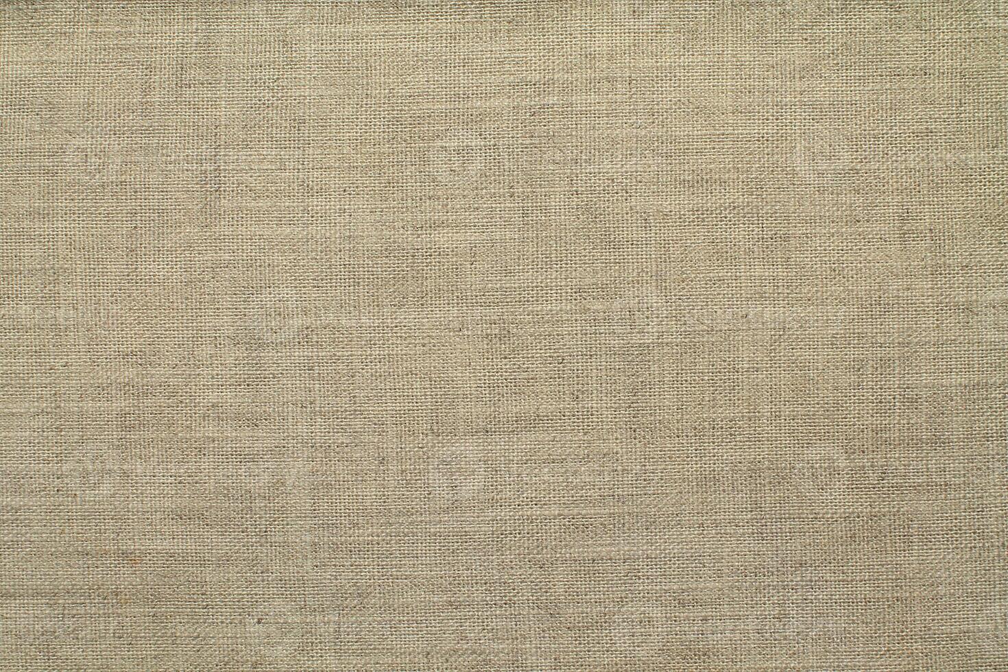 Natural linen material textile canvas Fabric texture background Close-up detail of fabric natural color Hemp material pattern design wallpaper. can be used as background or for graphic design photo