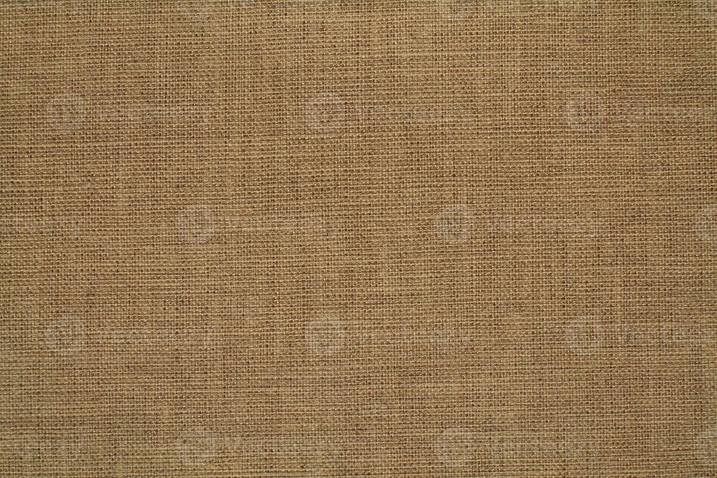Natural linen material textile canvas Fabric texture background Close-up detail of fabric natural color Hemp material pattern design wallpaper. can be used as background or for graphic design photo