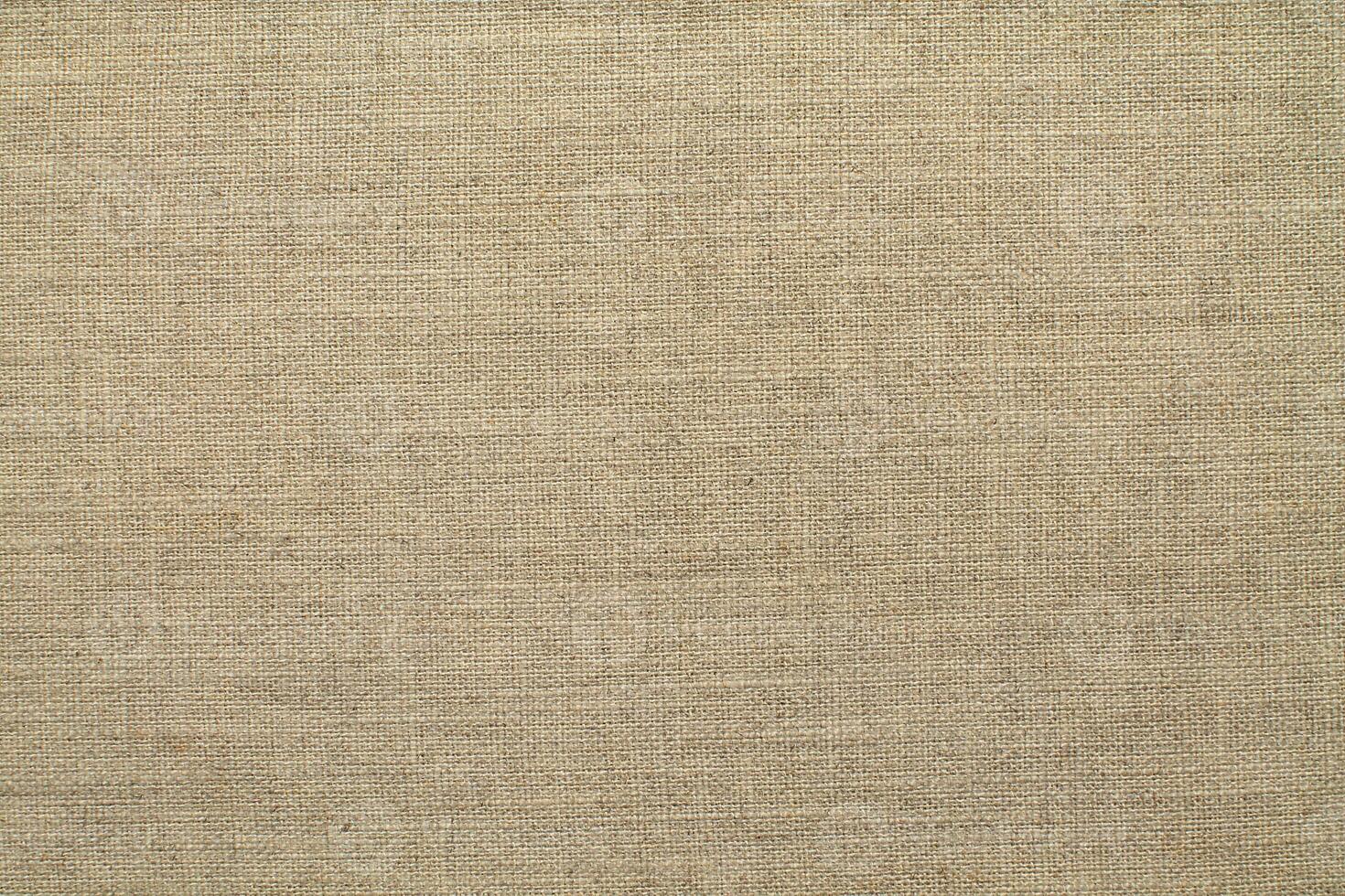Natural linen material textile canvas Fabric texture background Close-up detail of fabric natural color Hemp material pattern design wallpaper. can be used as background or for graphic design photo