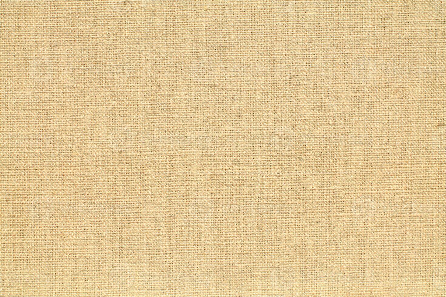 Natural linen material textile canvas Fabric texture background Close-up detail of fabric natural color Hemp material pattern design wallpaper. can be used as background or for graphic design photo