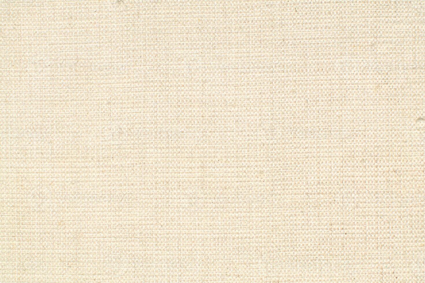 Natural linen material textile canvas Fabric texture background Close-up detail of fabric natural color Hemp material pattern design wallpaper. can be used as background or for graphic design photo