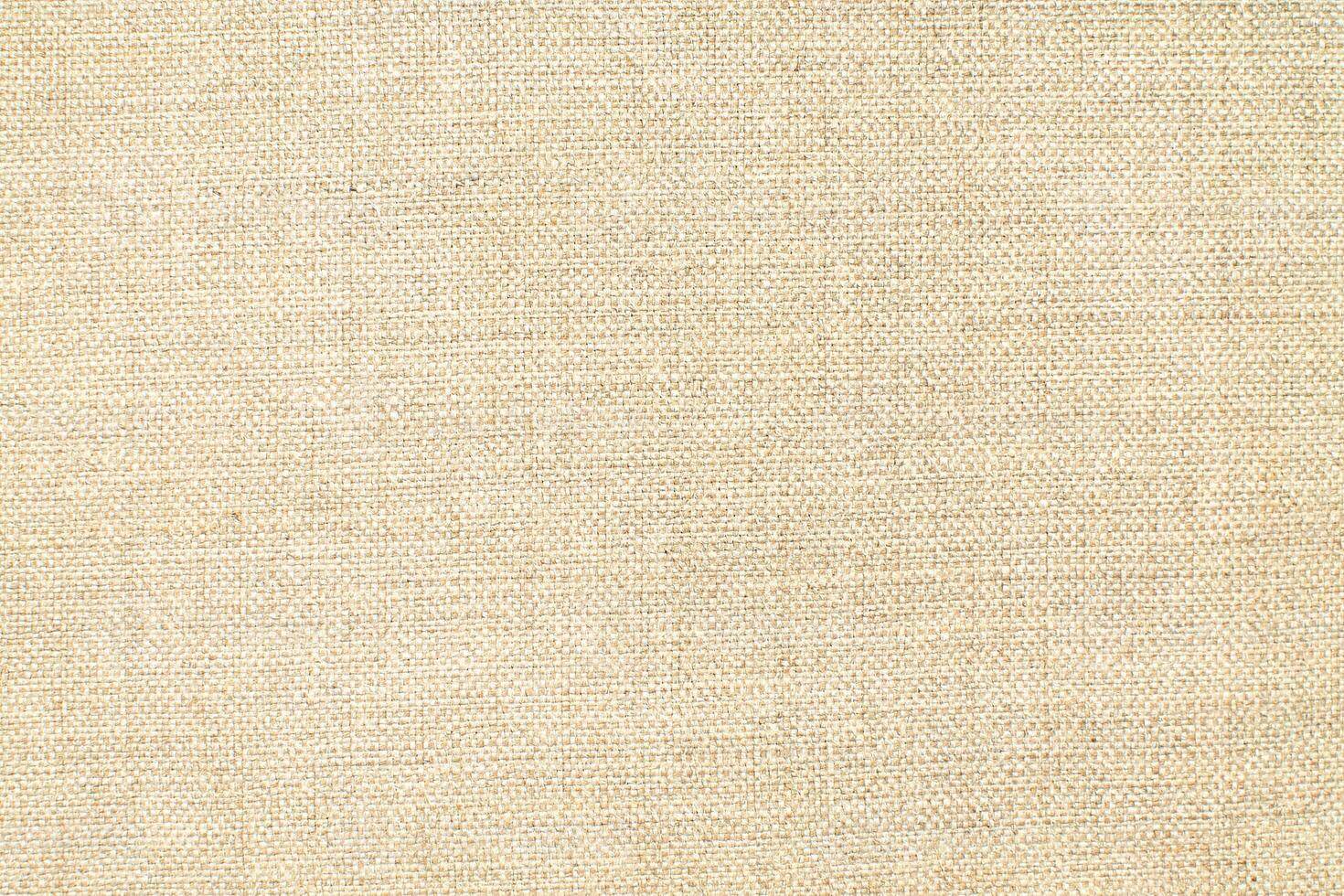 Natural linen material textile canvas Fabric texture background Close-up detail of fabric natural color Hemp material pattern design wallpaper. can be used as background or for graphic design photo