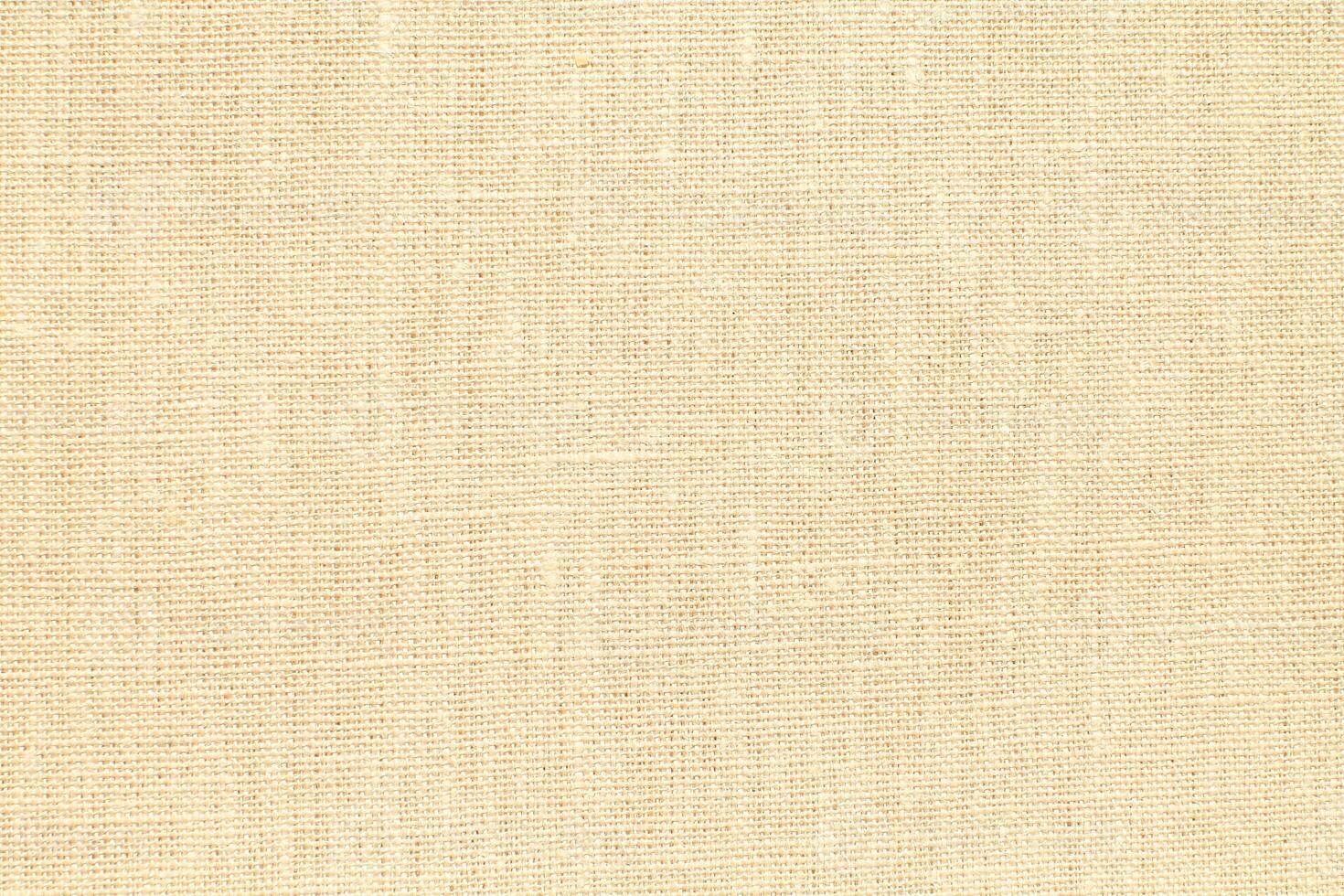 Natural linen material textile canvas Fabric texture background Close-up detail of fabric natural color Hemp material pattern design wallpaper. can be used as background or for graphic design photo