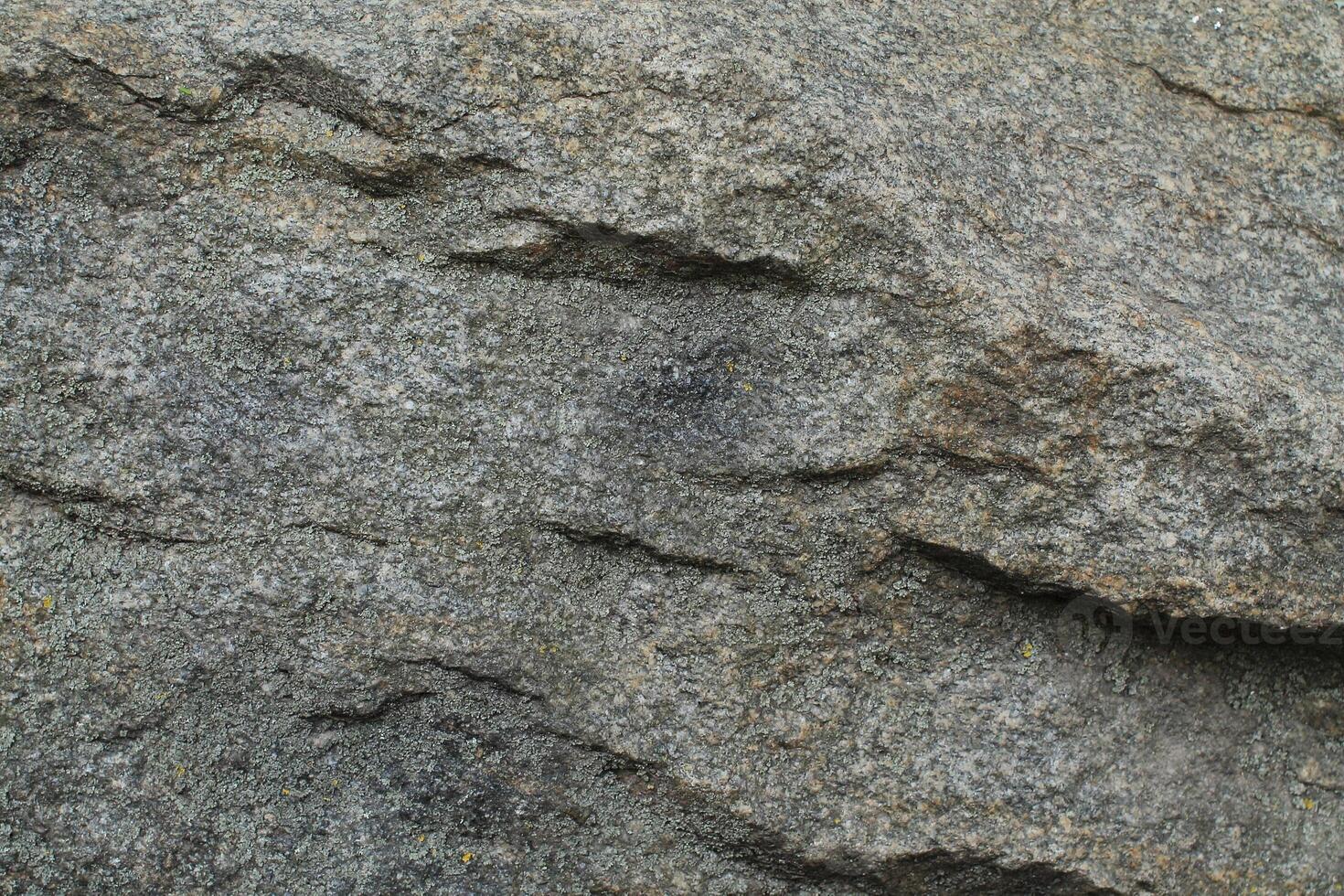 Abstract natural rock stone granite grunge rusty metal texture design background natural color stone material granite design wallpaper. Close-up detail of natural stone photo