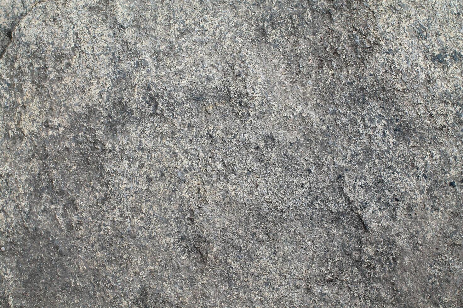 Abstract natural rock stone granite grunge rusty metal texture design background natural color stone material granite design wallpaper. Close-up detail of natural stone photo