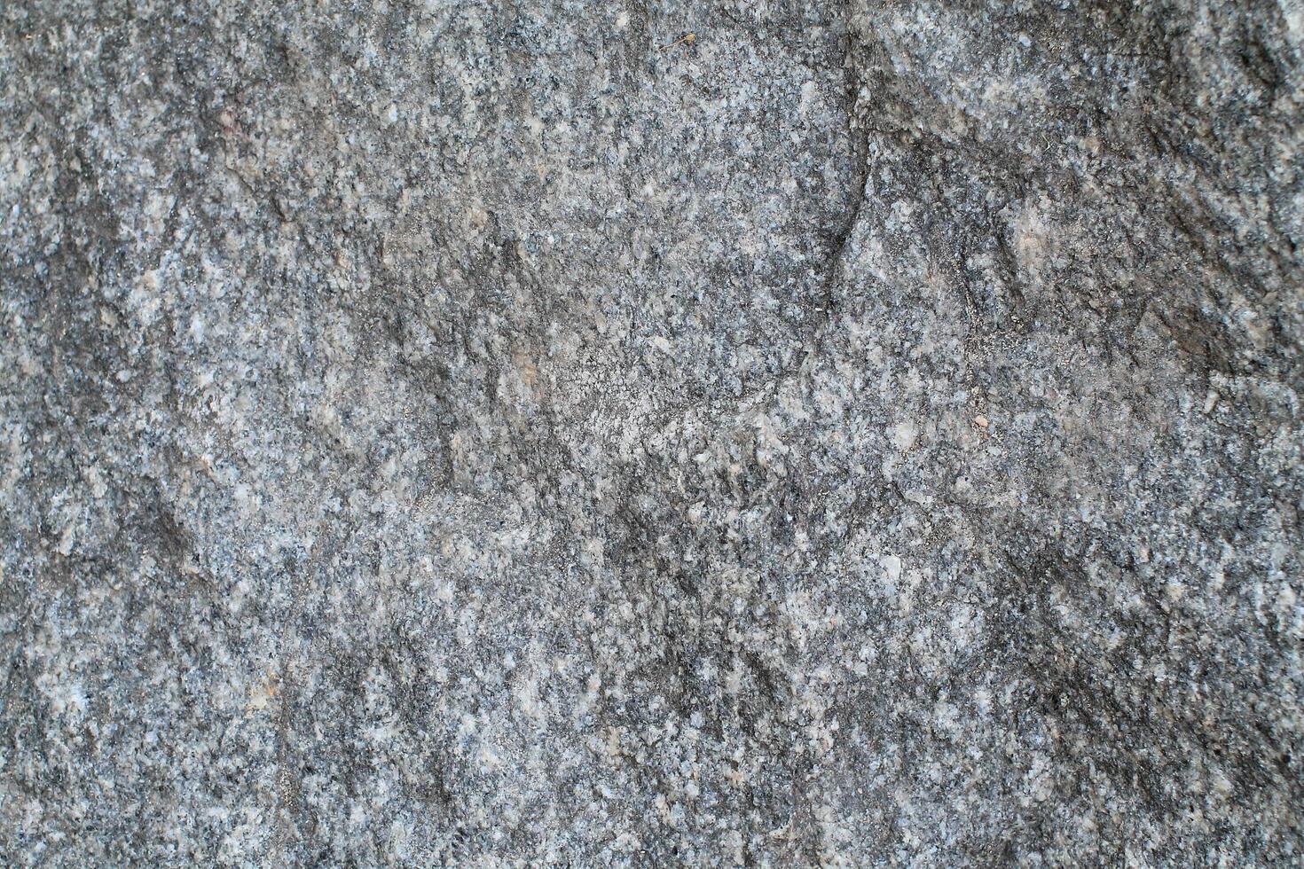 Abstract natural rock stone granite grunge rusty metal texture design background natural color stone material granite design wallpaper. Close-up detail of natural stone photo