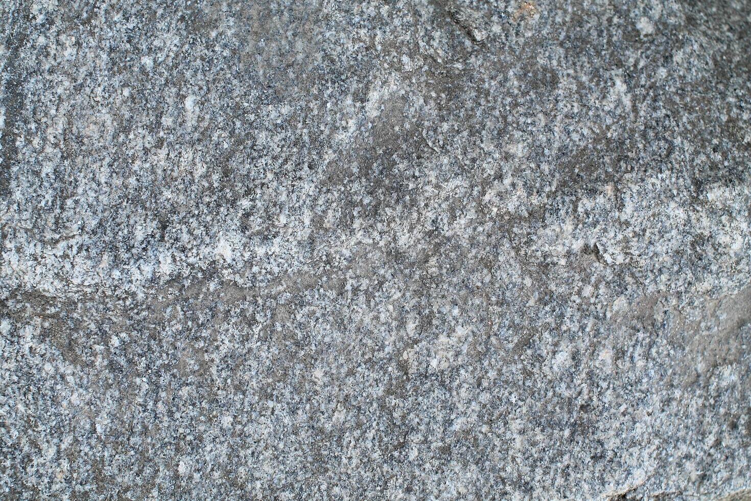 Abstract natural rock stone granite grunge rusty metal texture design background natural color stone material granite design wallpaper. Close-up detail of natural stone photo