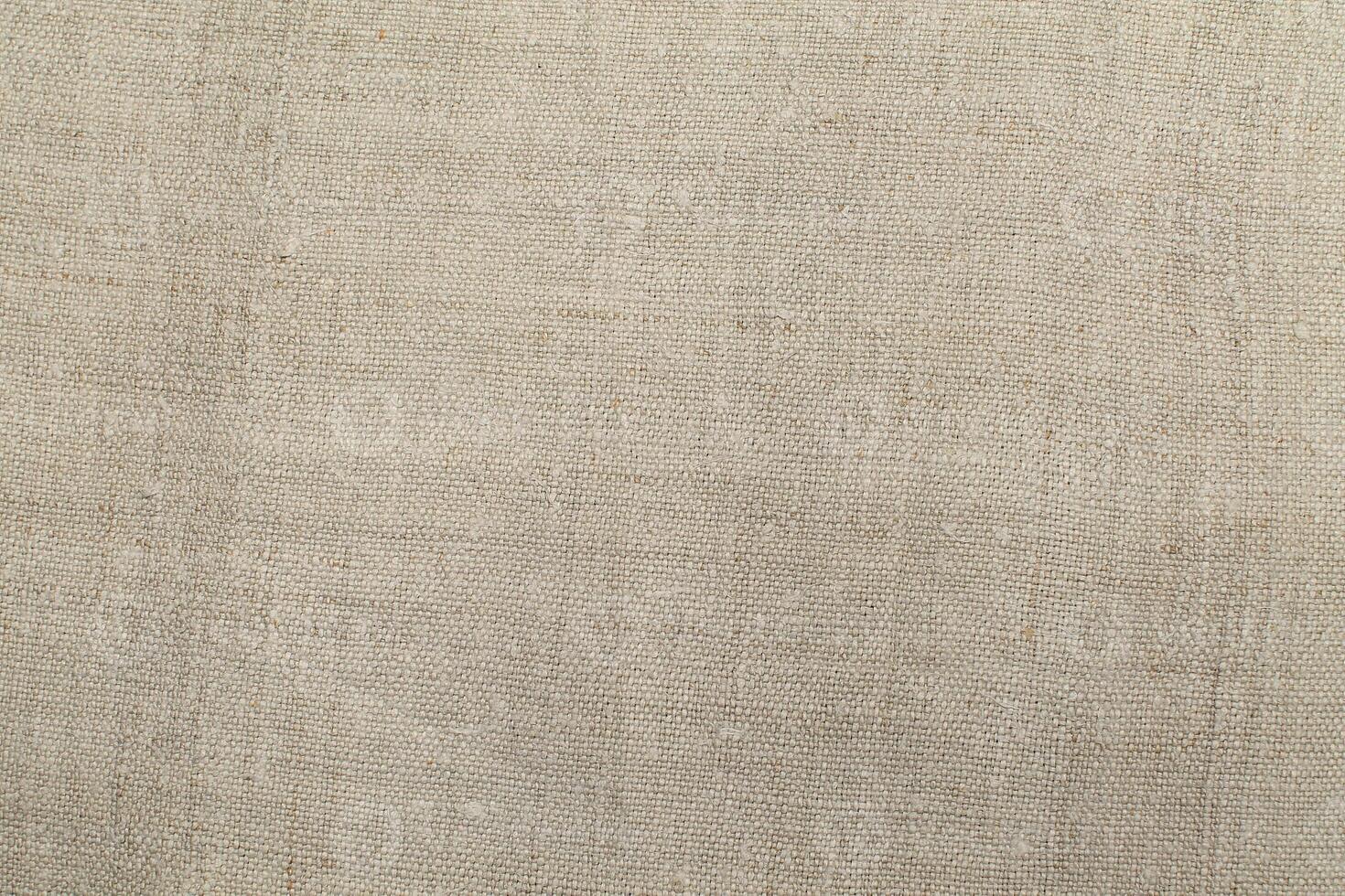 Natural linen material textile canvas Fabric texture background Close-up detail of fabric natural color Hemp material pattern design wallpaper. can be used as background or for graphic design photo