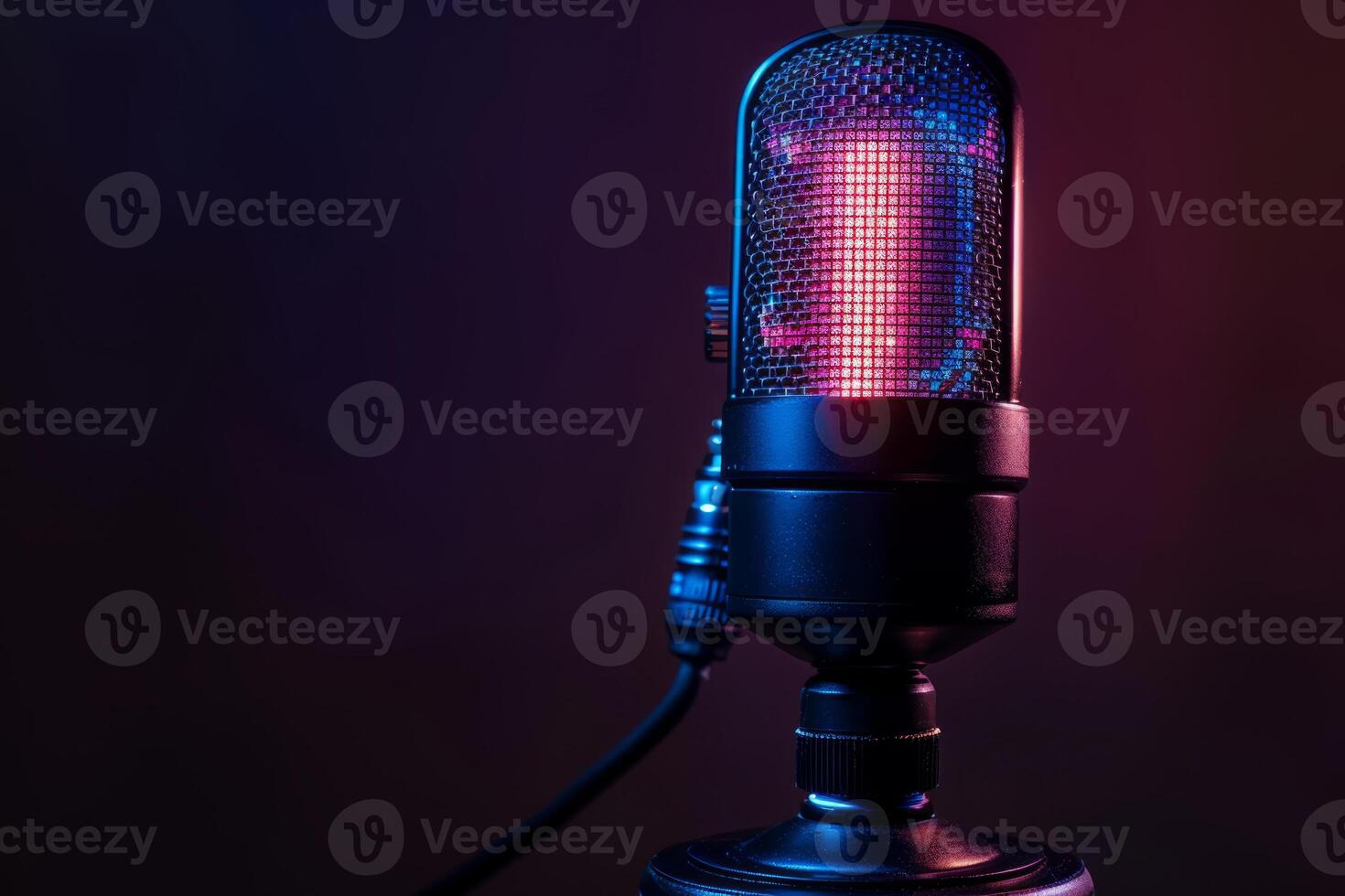 a voice and text microphone in neon light. Studio microphone on a dark background. Retro microphone. photo