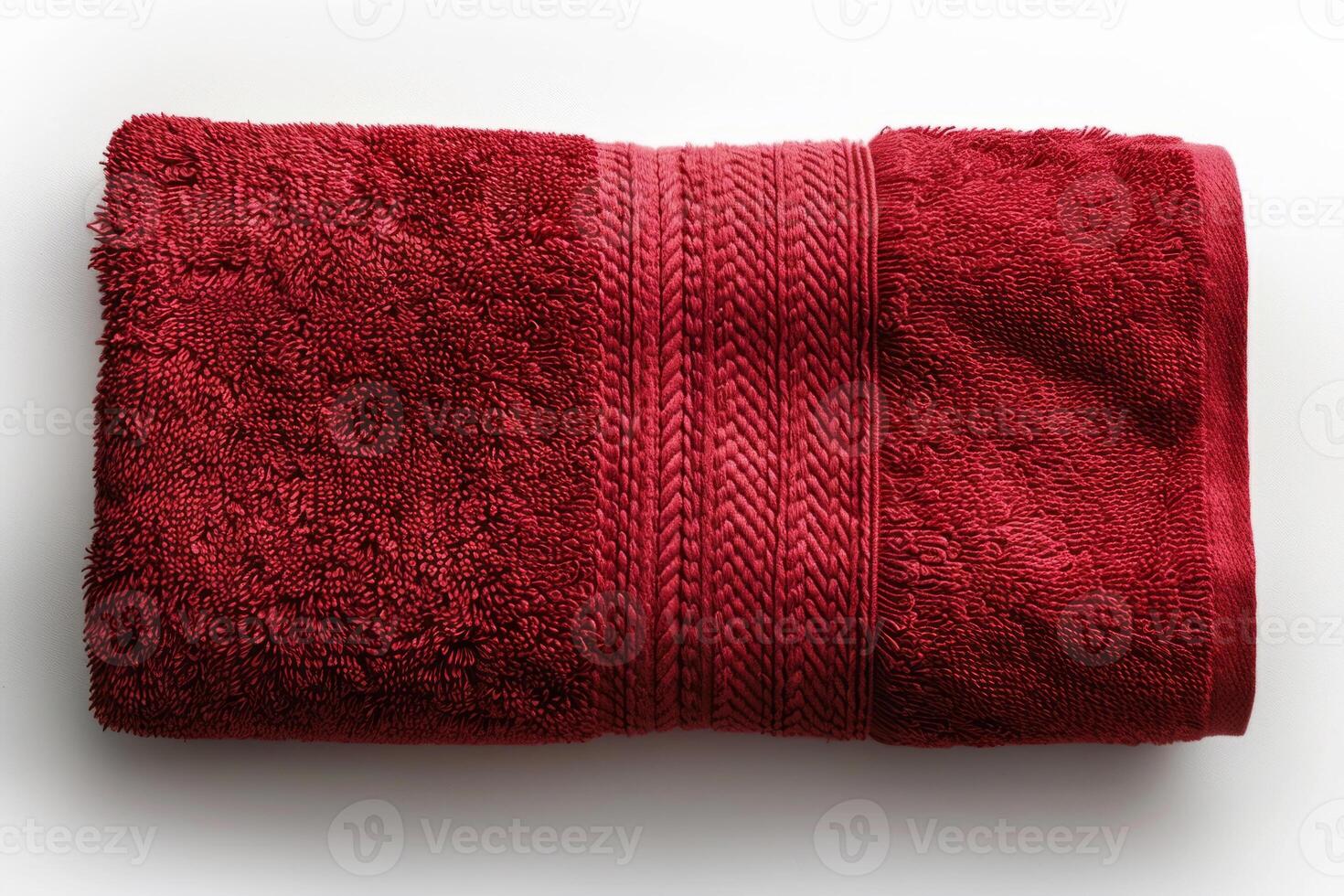 A red bath towel highlighted on a white background. Hand towel made of natural fabrics. Cotton. photo