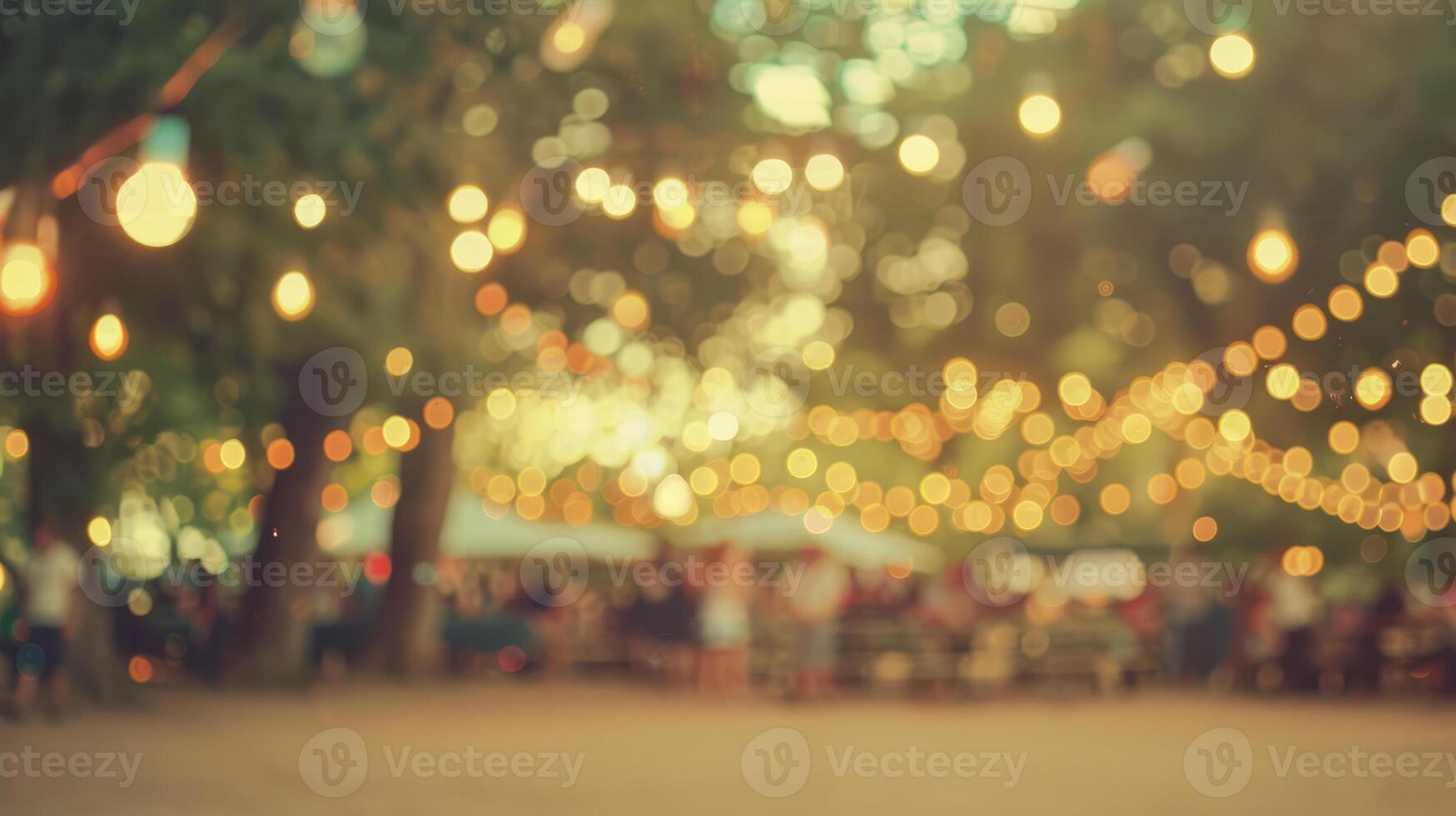 A blurred background with garlands and trees. An outdoor music festival. People are enjoying live music. The concept of a summer party. photo