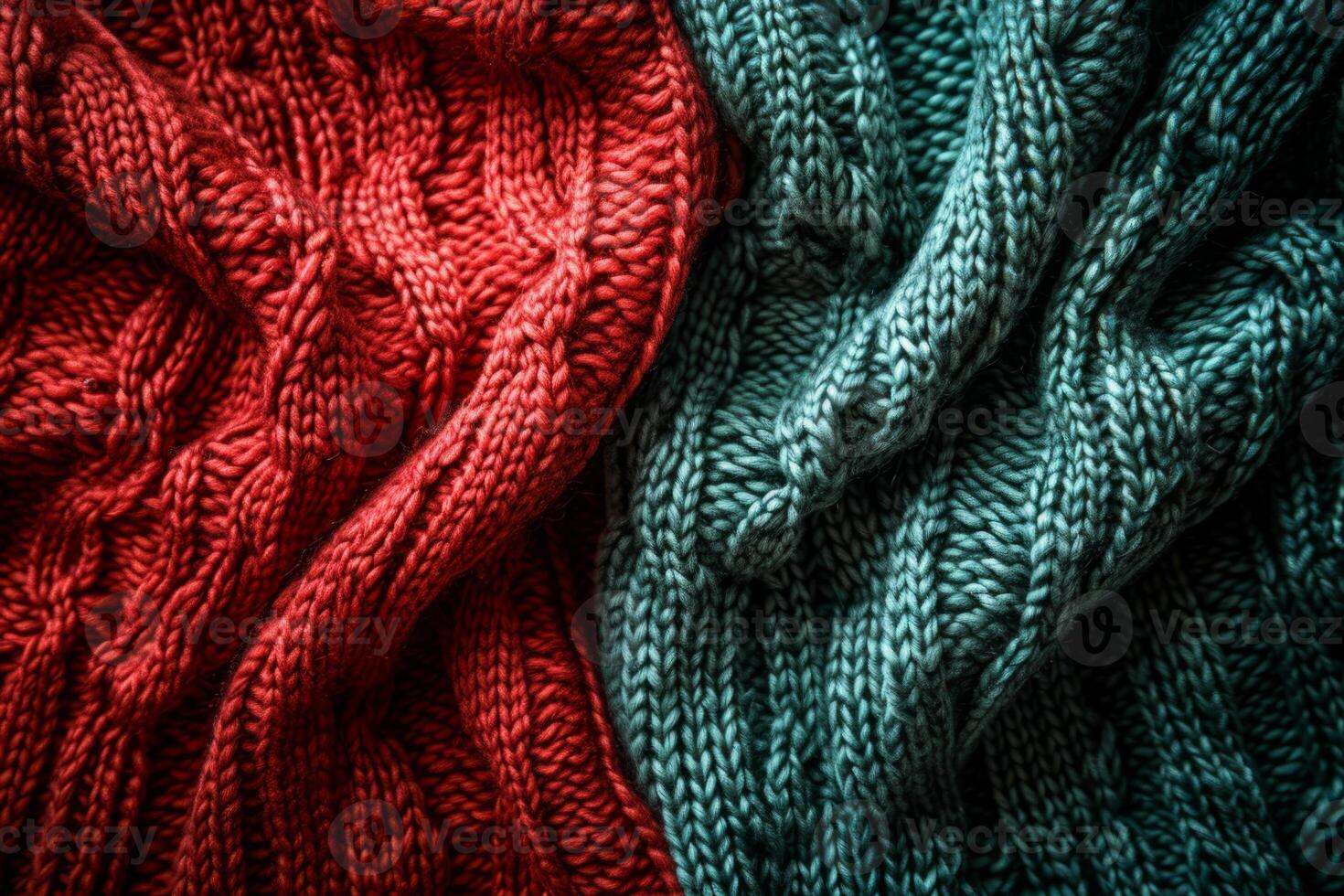 photo of two knitted sweaters lying side by side folded in half close-up red and green large knitting