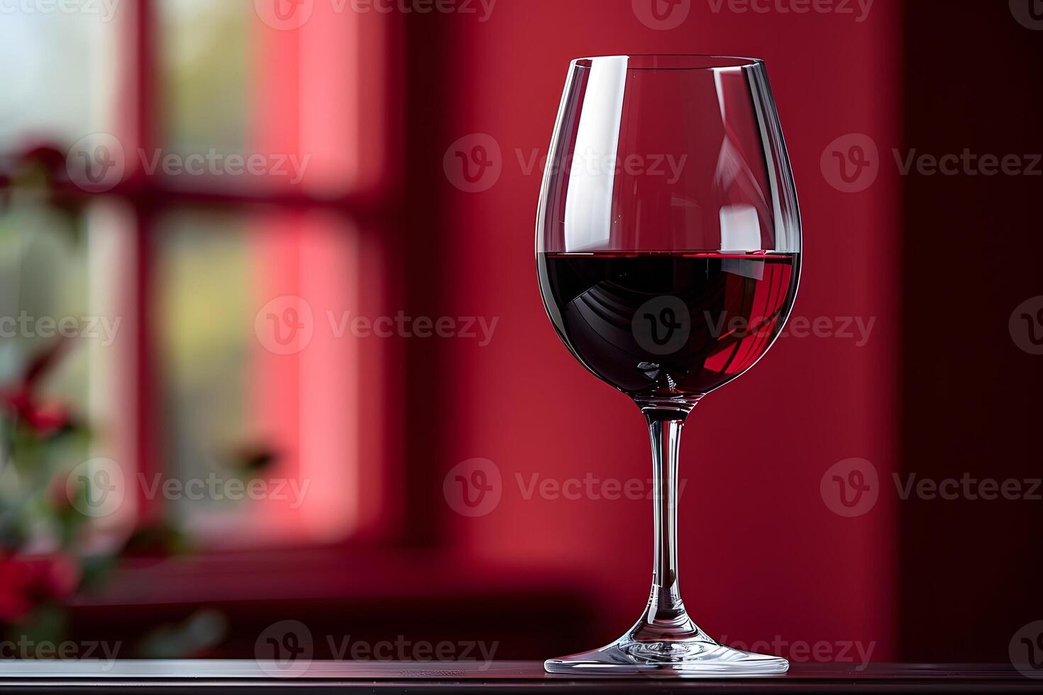 Red Wine Glass in Ambient Window Light - Ideal for Home Decor and Elegance Concepts photo