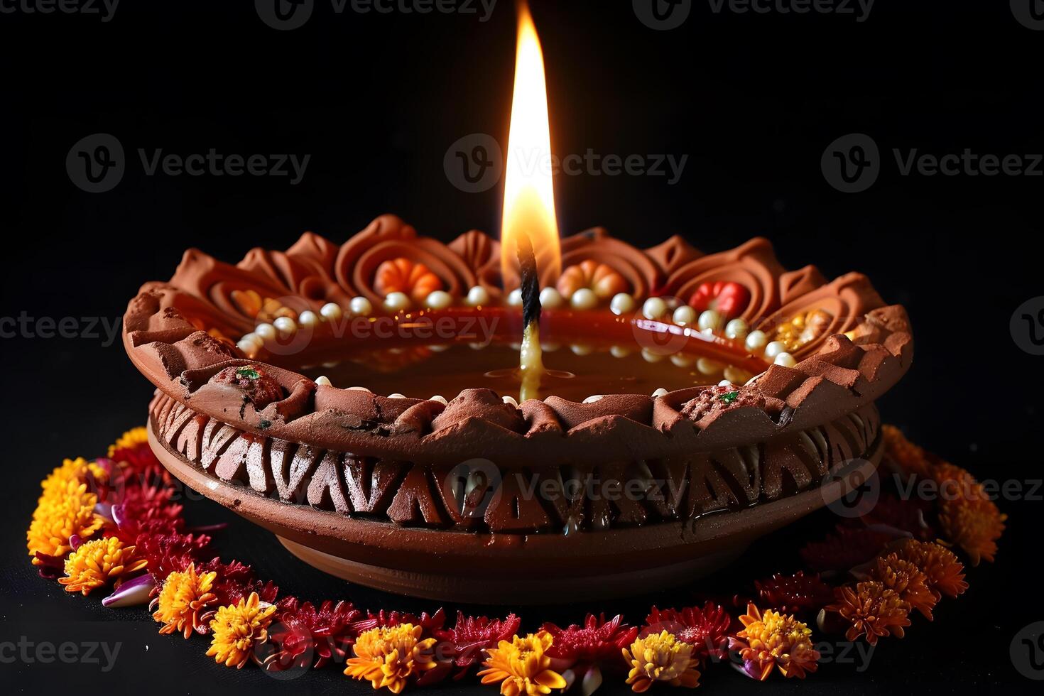 Traditional Diya Lamp with Marigold Flower Decoration for Diwali Celebrations and Festive Decor photo