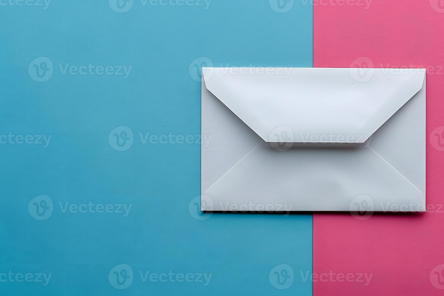Minimalist White Envelope on Split Pink and Blue Background - Ideal for Invitations, Announcements, and Correspondence photo