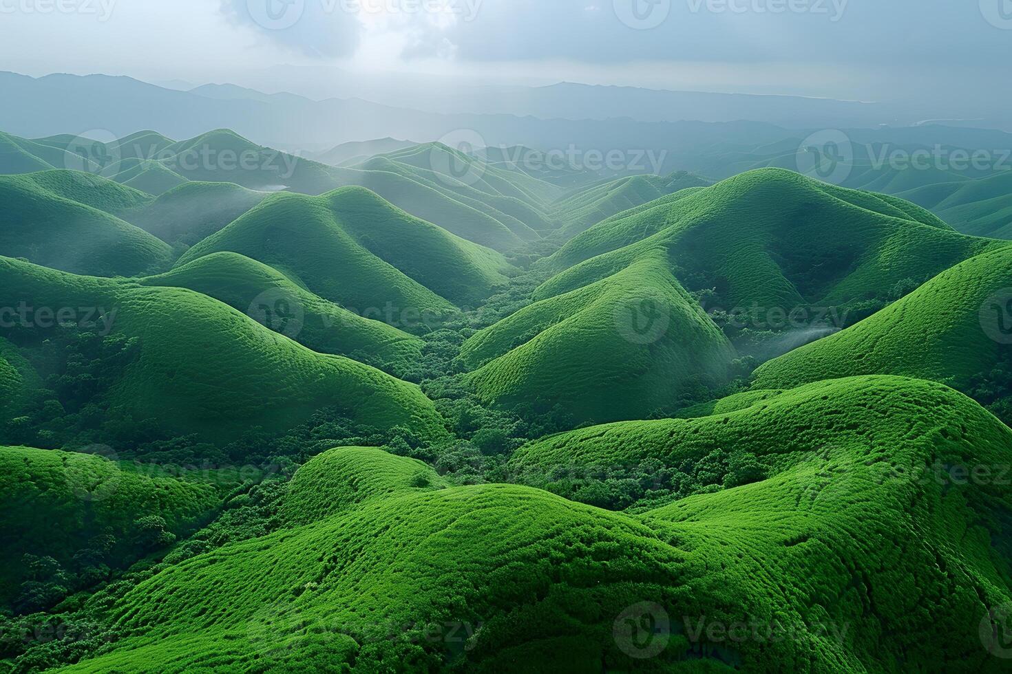 Lush Green Rolling Hills Under a Cloudy Sky - Nature Landscape for Design and Poster photo