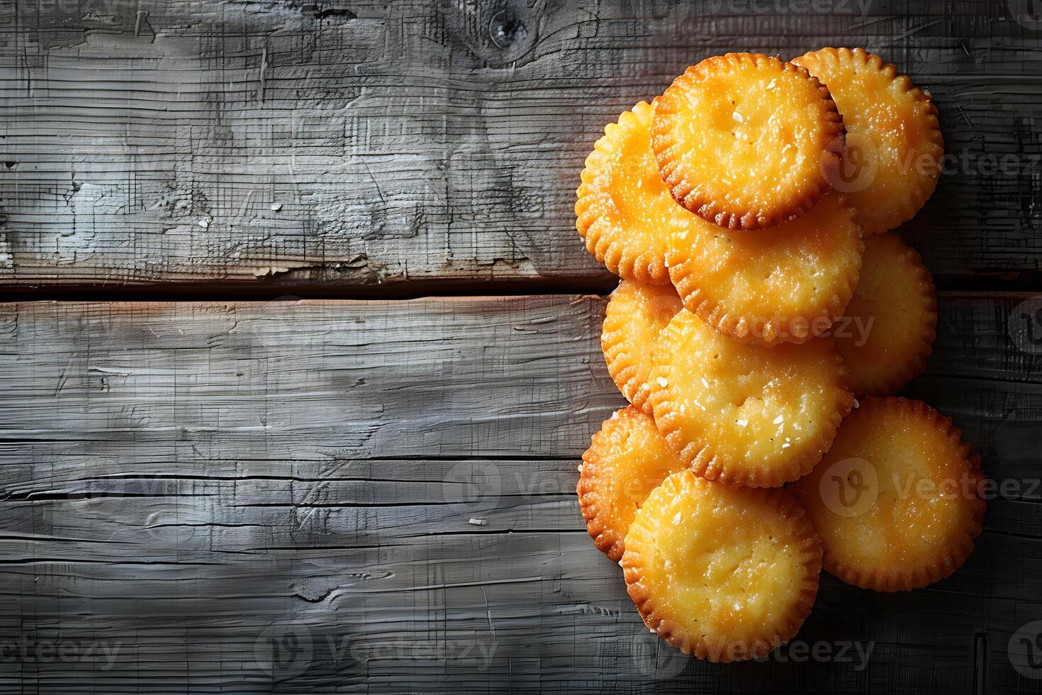 Golden Cheese Crackers on Rustic Wooden Table - Perfect for Snack Time Design for Print, Card, Poster photo