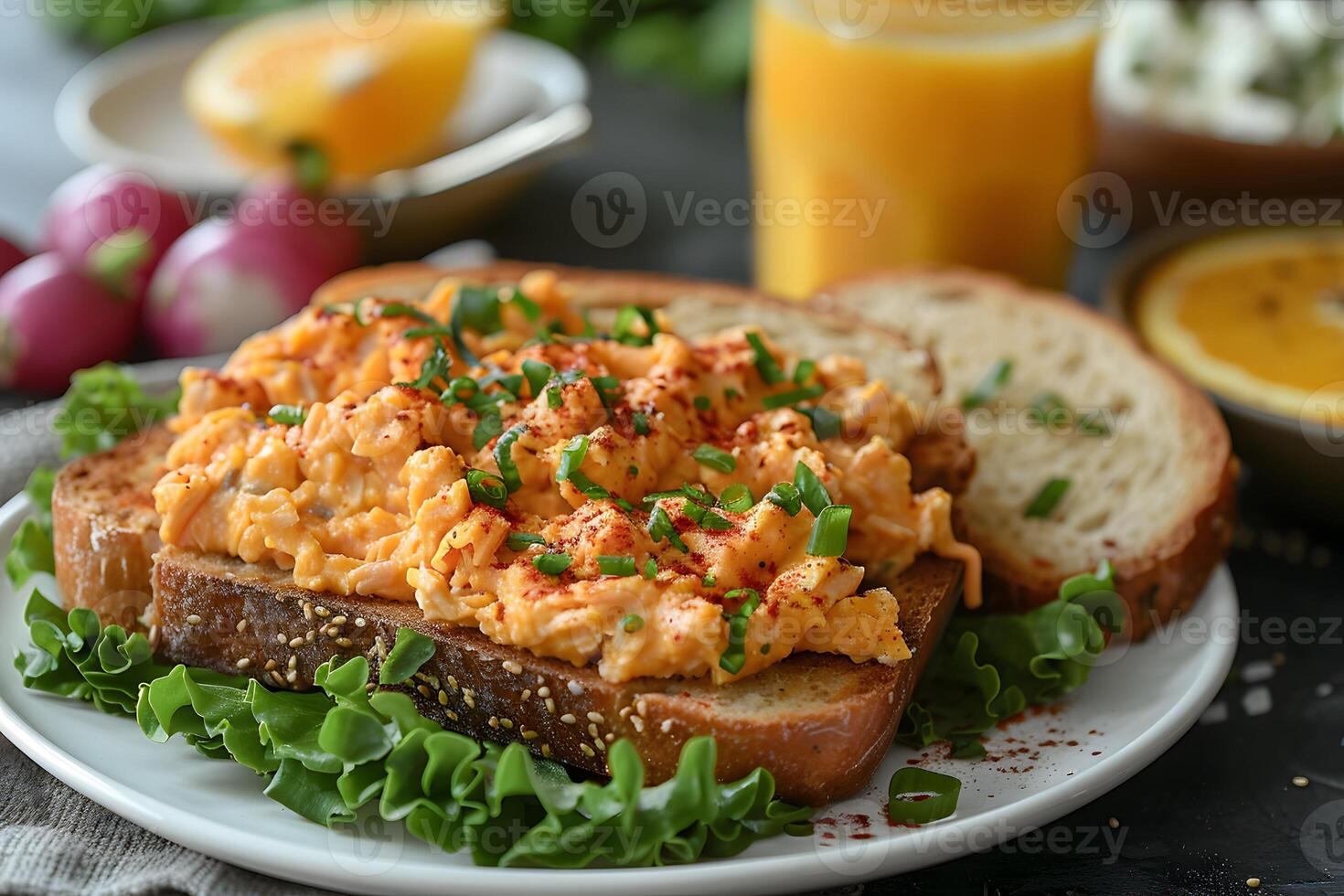 Delicious Scrambled Egg Sandwich with Toasted Bread and Fresh Vegetables for Breakfast or Brunch photo
