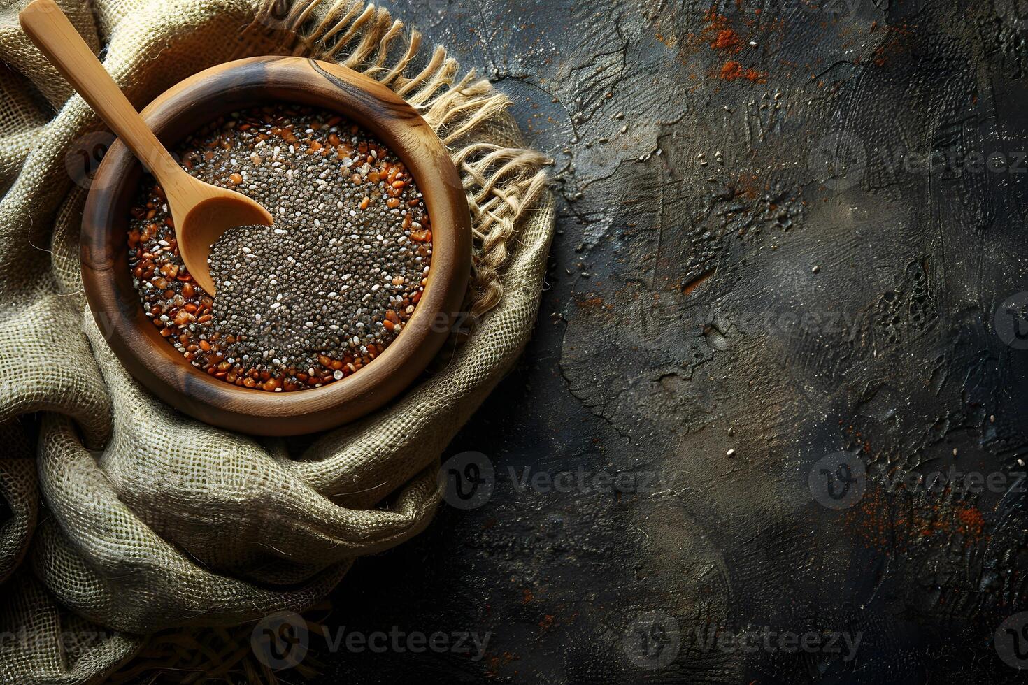 Healthy Chia Seeds in a Wooden Bowl with a Wooden Spoon on Rustic Fabric Perfect for Culinary and Health-Themed Designs photo
