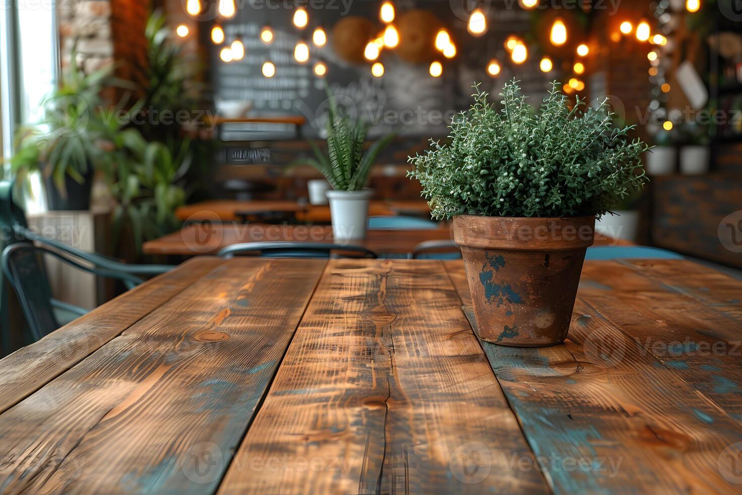 Cozy Rustic Restaurant with Wooden Table and Potted Plant Decor for Relaxing Ambiance photo