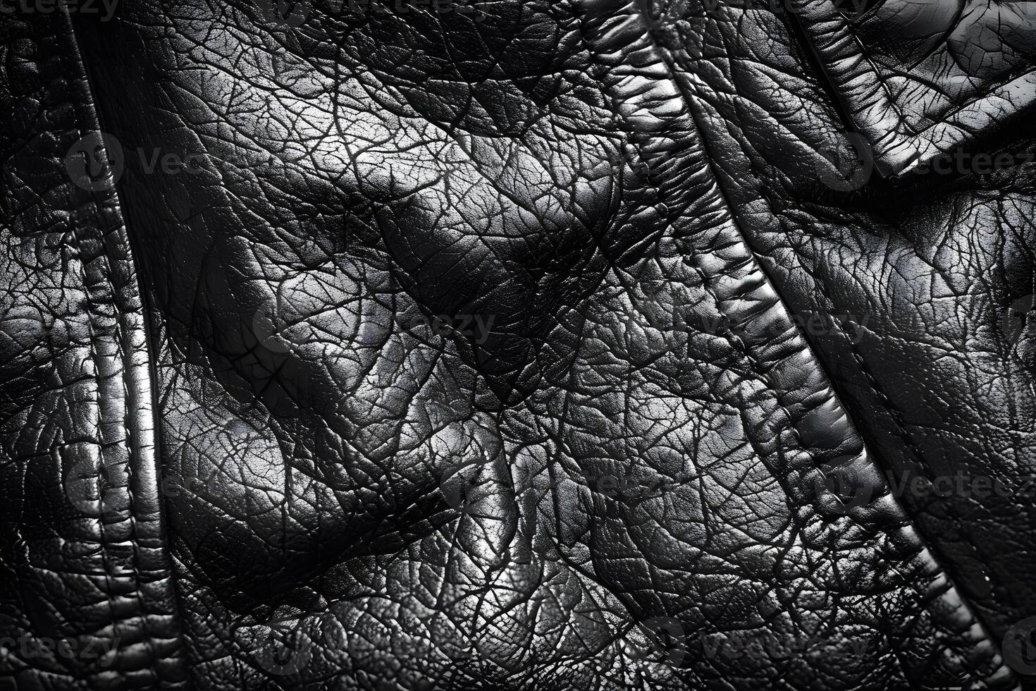 Textured Black Leather Surface with Detailed Creases and Stitching for Fashion Design, Upholstery, and Craft Projects photo