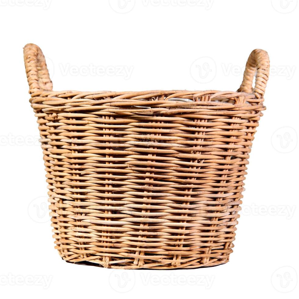 Woven Natural Rattan Basket with Handles on a White Background Isolated for Storage and Decoration photo