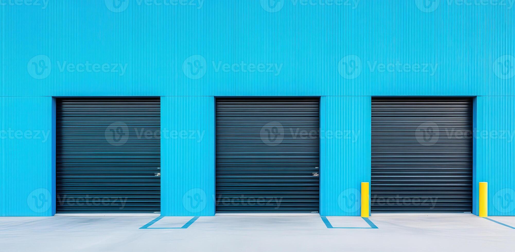 Vibrant blue wall with three black garage doors, showcasing modern architecture and clean lines in an urban setting. photo