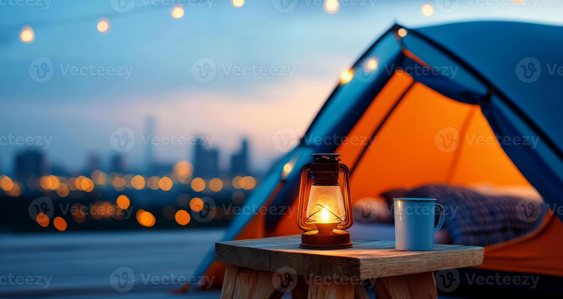 Serene camping scene at dusk, featuring a glowing lantern, cozy tent, and distant city lights, perfect for outdoor enthusiasts. photo